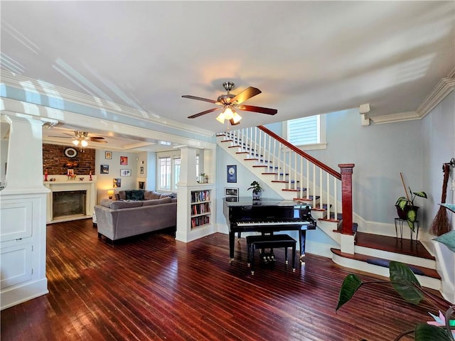 living room featuring ceiling fan, a healthy amount of sunlight, crown molding, and dark hardwood / wood-style floors