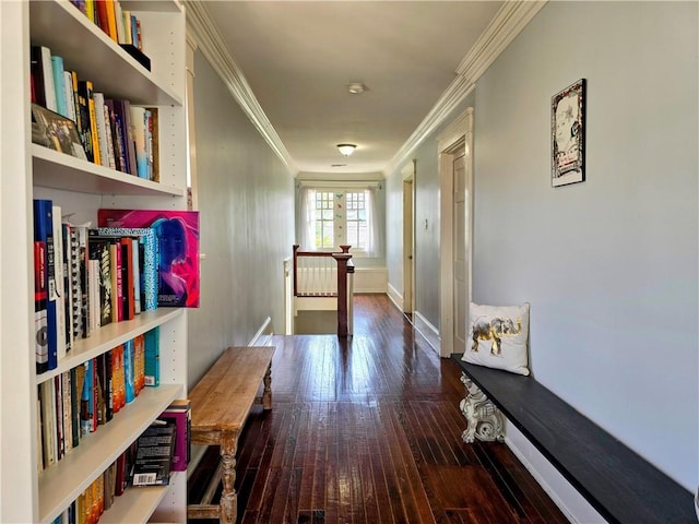 hallway featuring ornamental molding and wood-type flooring