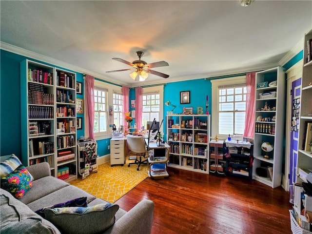 office featuring wood-type flooring, crown molding, and a healthy amount of sunlight