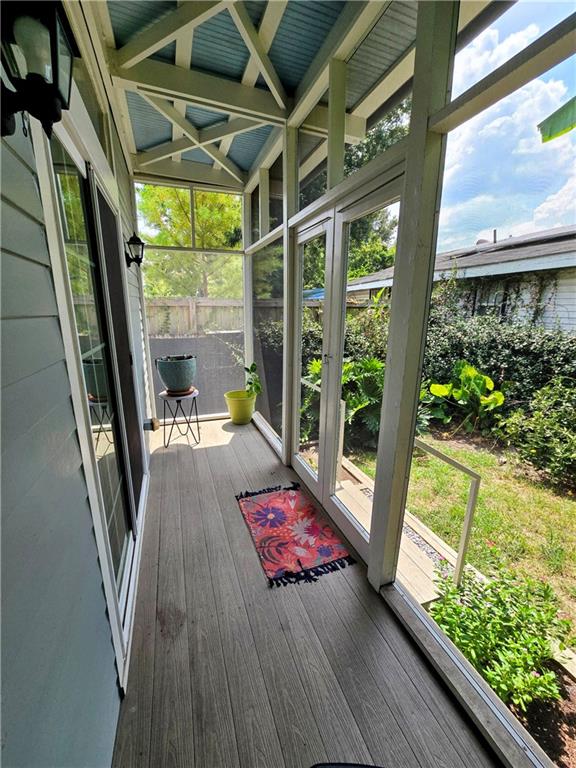 unfurnished sunroom featuring a healthy amount of sunlight