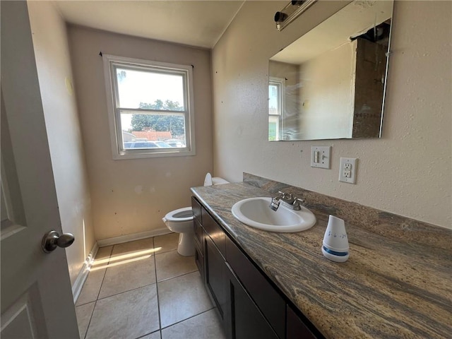 bathroom featuring vanity, toilet, and tile patterned floors