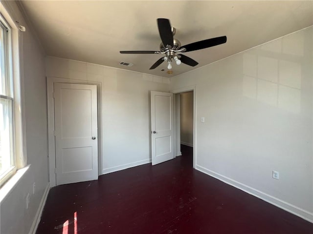 unfurnished bedroom with ceiling fan