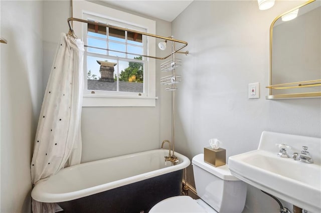 bathroom with toilet and sink