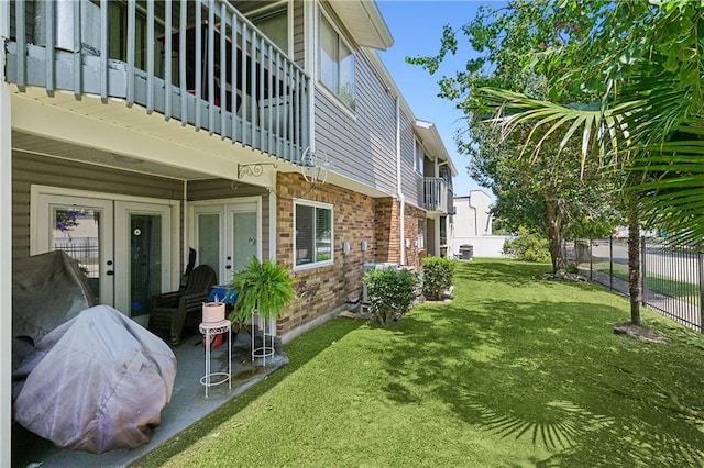 exterior space with central AC, a patio, and a balcony