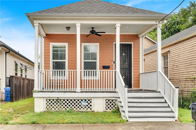 bungalow with ceiling fan and a porch