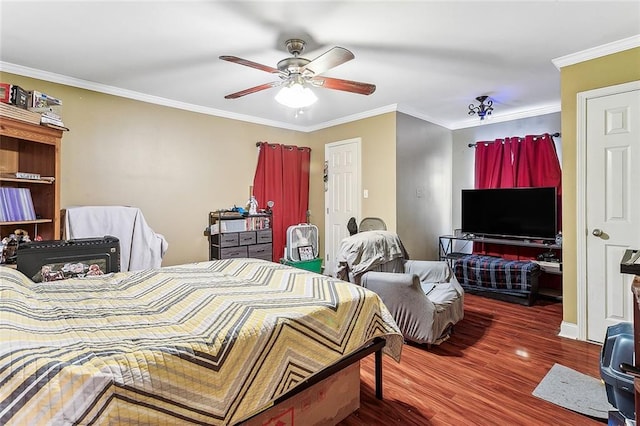 bedroom with ceiling fan, dark hardwood / wood-style flooring, and crown molding