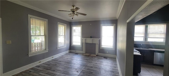 kitchen featuring dishwasher, crown molding, hardwood / wood-style floors, and ceiling fan