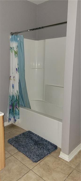 bathroom featuring shower / bath combination with curtain, vanity, and tile patterned floors