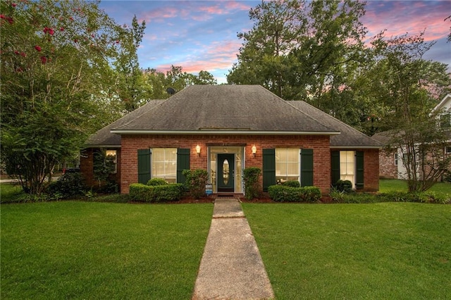 view of front of home featuring a yard