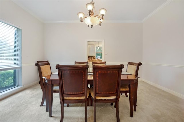 carpeted dining area featuring ornamental molding and a notable chandelier