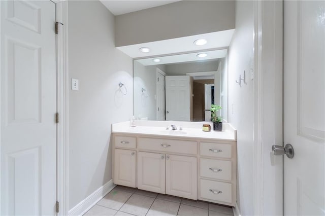 bathroom featuring tile patterned flooring and vanity