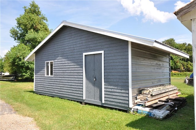 view of outdoor structure with a yard