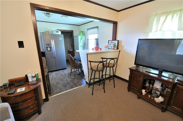 interior space featuring crown molding and hardwood / wood-style flooring