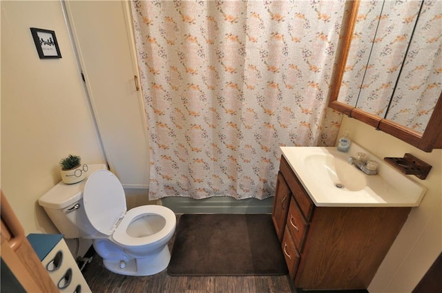 full bathroom featuring vanity, toilet, shower / tub combo with curtain, and hardwood / wood-style floors