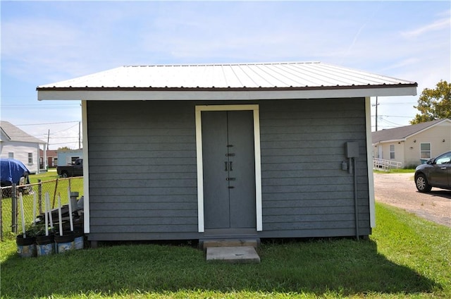 view of outdoor structure with a lawn