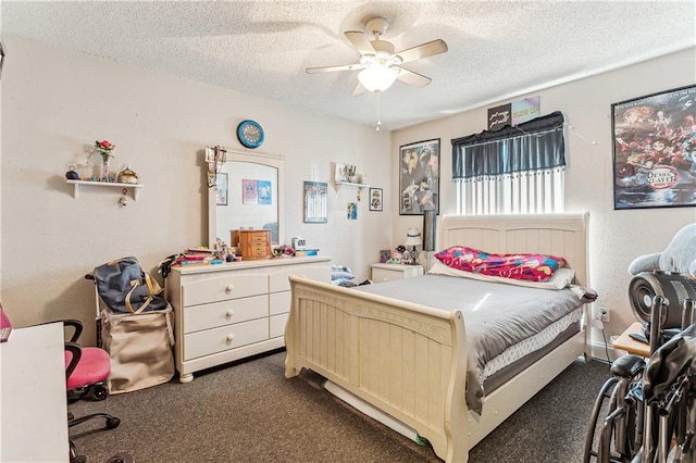 bedroom featuring a textured ceiling, ceiling fan, and dark colored carpet