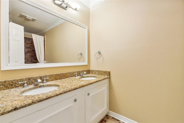 bathroom featuring vanity and crown molding