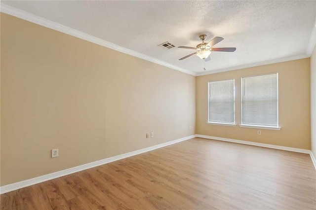 unfurnished room featuring hardwood / wood-style flooring, ceiling fan, crown molding, and a textured ceiling