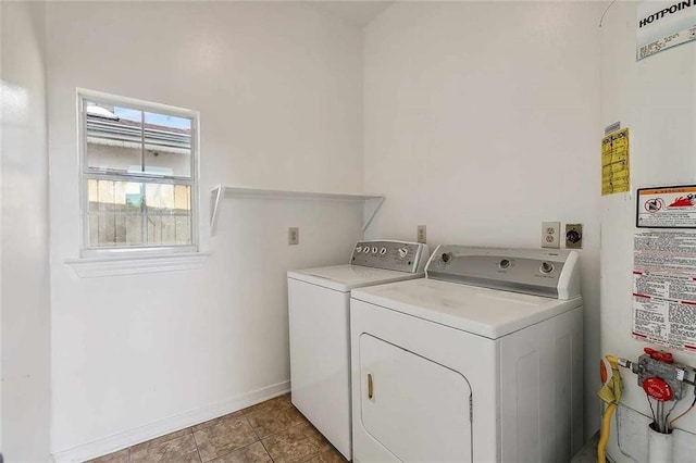 laundry area with separate washer and dryer, tile patterned flooring, and gas water heater