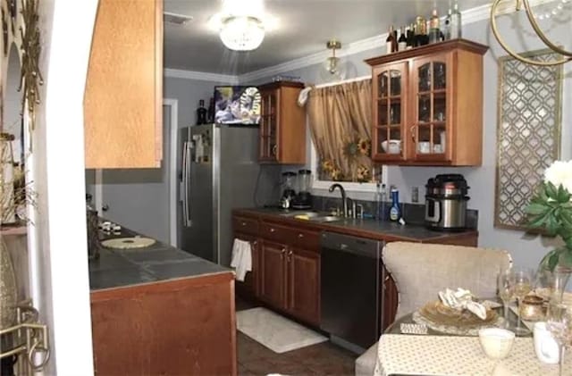 kitchen with dishwasher, dark tile patterned floors, sink, stainless steel fridge, and ornamental molding