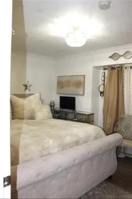 bedroom with ornamental molding