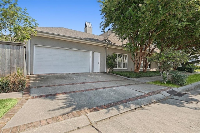 ranch-style house featuring a garage