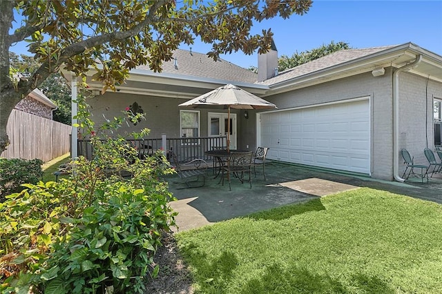 single story home with a patio area and a front lawn