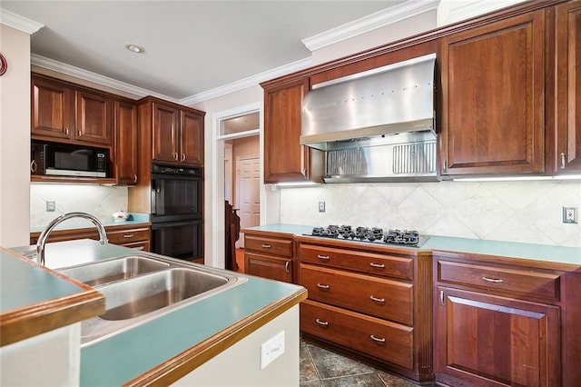 kitchen featuring appliances with stainless steel finishes, tasteful backsplash, ornamental molding, sink, and wall chimney range hood