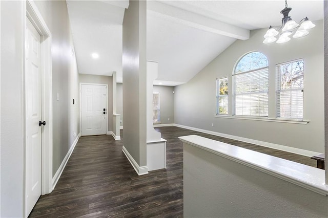 hallway with dark wood-type flooring, vaulted ceiling with beams, and a chandelier