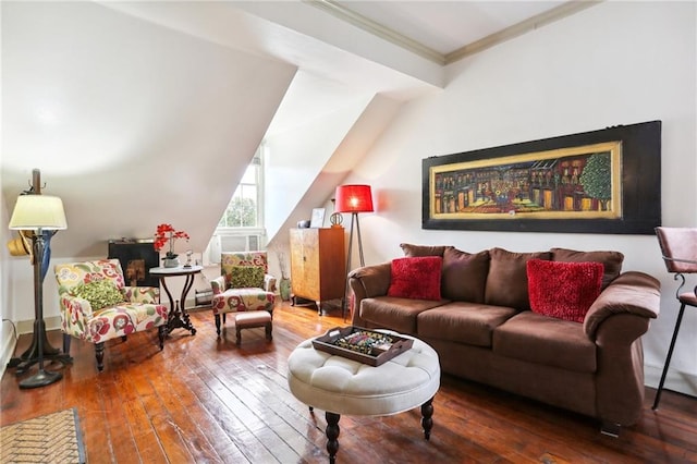 living room with ornamental molding, lofted ceiling, and hardwood / wood-style floors