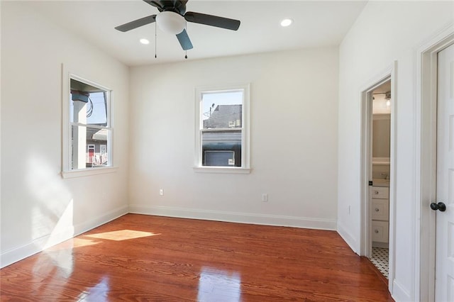 unfurnished room featuring recessed lighting, baseboards, wood finished floors, and ceiling fan