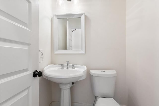 bathroom featuring toilet