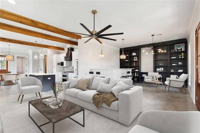 417 Nursery Ave, Metairie, LA 70005 - living room with finished concrete flooring, visible vents, ceiling fan, beam ceiling, and built in features