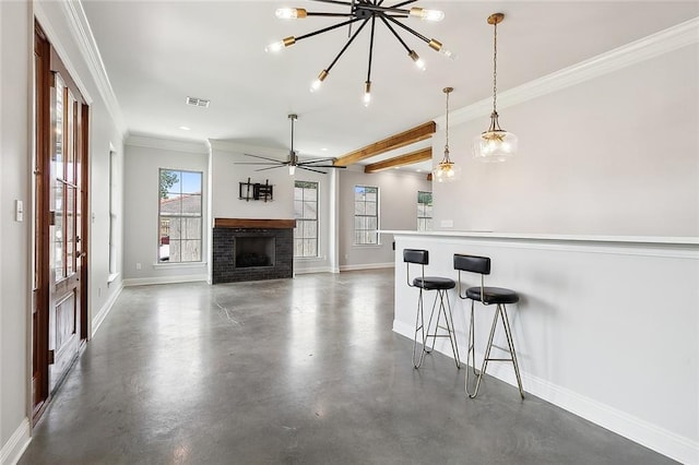 kitchen with a breakfast bar area, visible vents, finished concrete floors, a brick fireplace, and baseboards