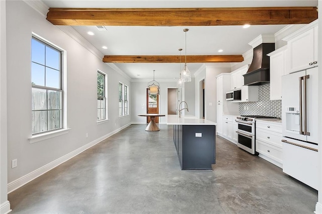 kitchen with high end fridge, a center island with sink, double oven range, premium range hood, and beam ceiling