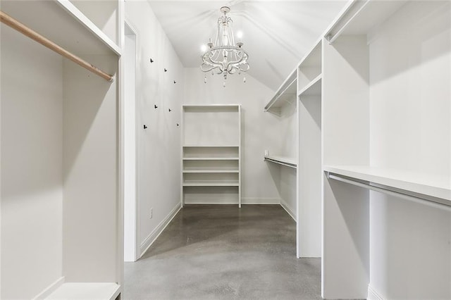 spacious closet featuring a notable chandelier