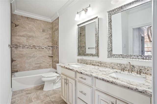 full bathroom with crown molding, vanity, tiled shower / bath combo, and toilet