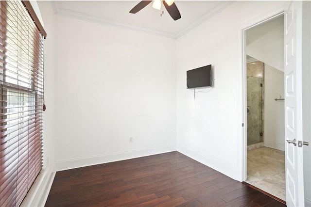 spare room with dark hardwood / wood-style floors, ceiling fan, and ornamental molding