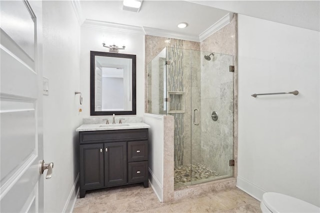 bathroom featuring ornamental molding, vanity, toilet, and a shower with shower door