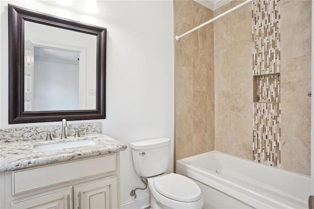 full bathroom with toilet, vanity, and tiled shower / bath