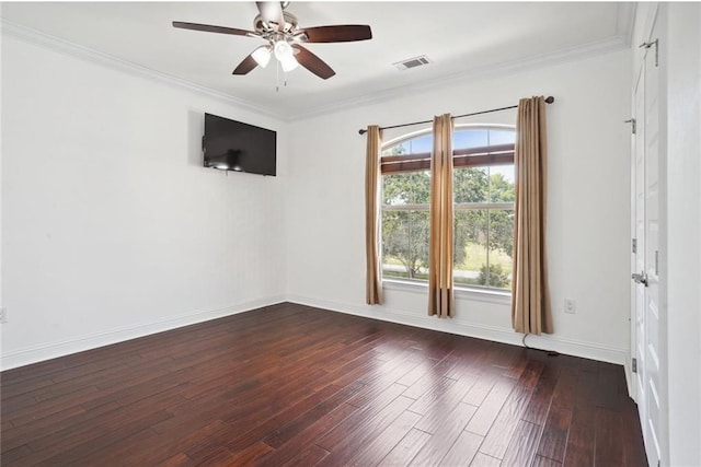 unfurnished room featuring ceiling fan, dark wood-type flooring, and ornamental molding