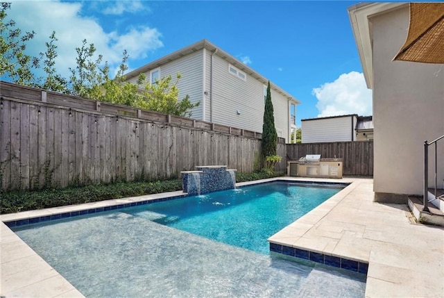 view of pool with pool water feature and area for grilling