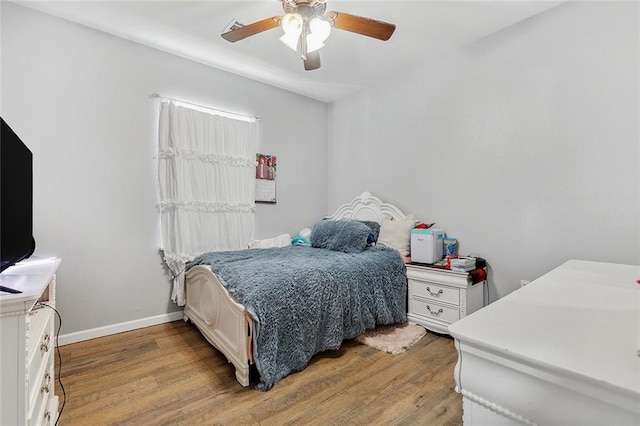 bedroom featuring ceiling fan and light hardwood / wood-style flooring