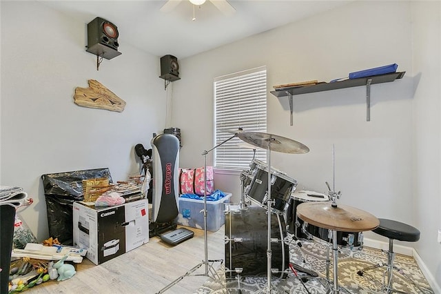 miscellaneous room with hardwood / wood-style floors and ceiling fan