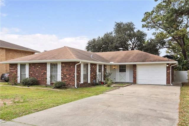 ranch-style house with a front yard and a garage