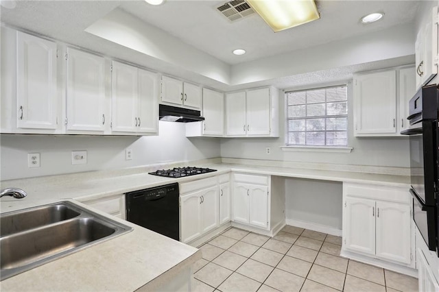 kitchen with white cabinets and black appliances