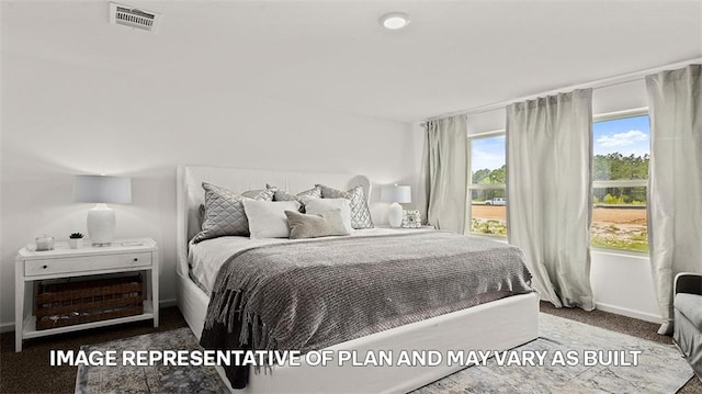 bedroom with baseboards, visible vents, and carpet floors