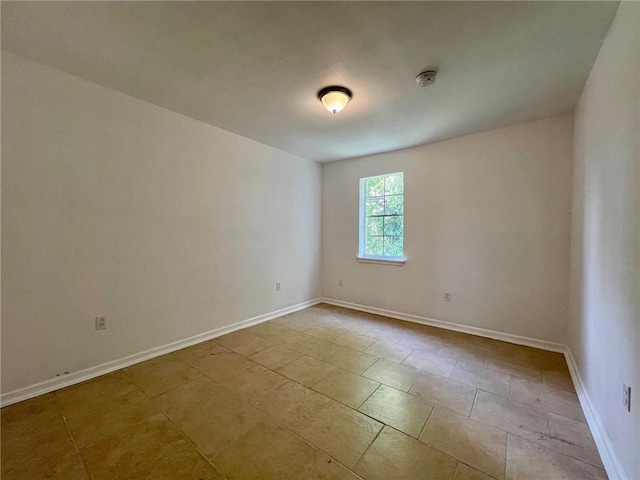 empty room with light tile patterned flooring