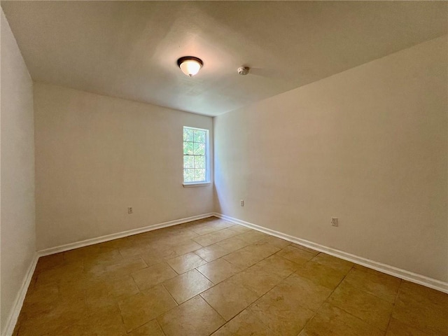 empty room with light tile patterned floors