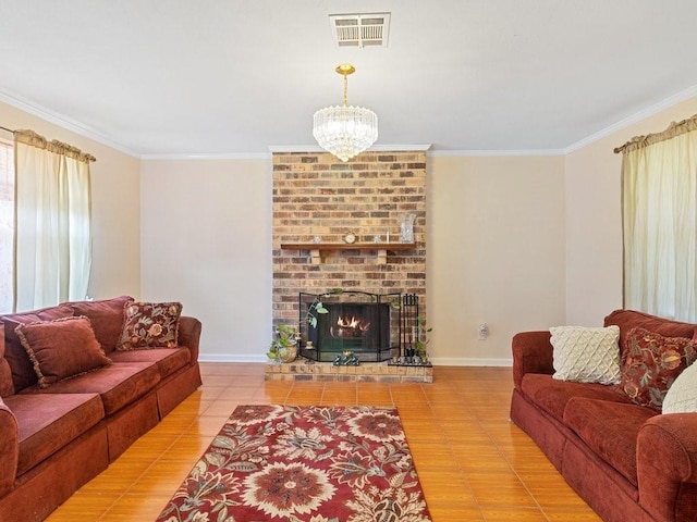 living room featuring ornamental molding, a brick fireplace, an inviting chandelier, and light tile patterned flooring